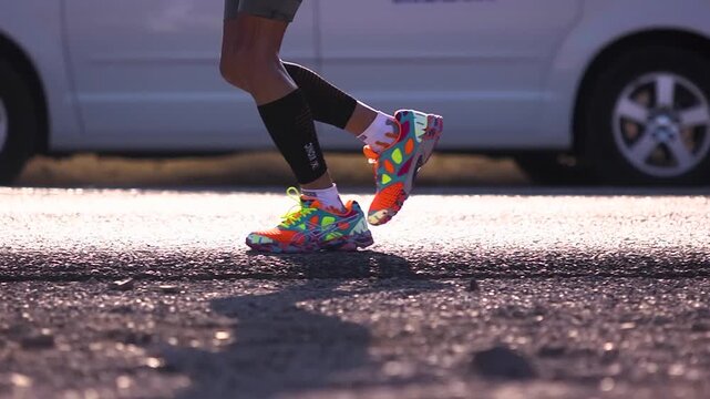Close up of athletes feet running through death valley