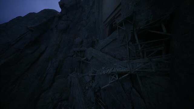 Steep vertical ascent toward ancient ruins, craggy stone faces and narrow ledges visible in dim light, weathered masonry and looming silhouettes create