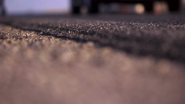 Close up of runners feet on the asphalt as they run by