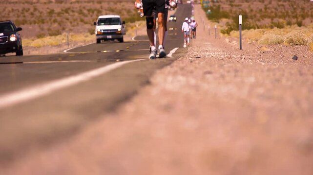 Close up of runners feet on the death valley road