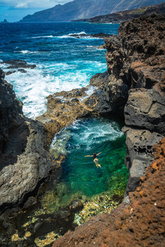 Woman swimming natural pool el hierro canary islands