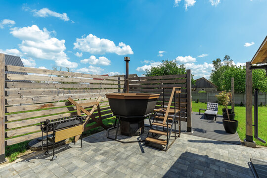 Backyard Patio with Hot Tub, Grill, and Relaxation Deck