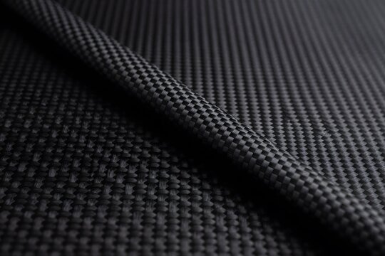 Dark carbon fiber texture with premium woven pattern and modern industrial style