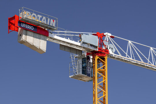 Nancy, France - July 20th 2026 : View on a flat-top tower crane Potain MDT 109 on a construction site for the construction of a building.
