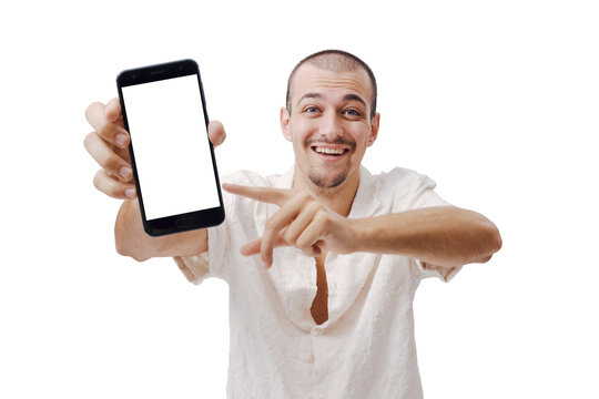 Smiling Young Man Pointing at Smartphone Blank White Screen Mockup on Blue Background