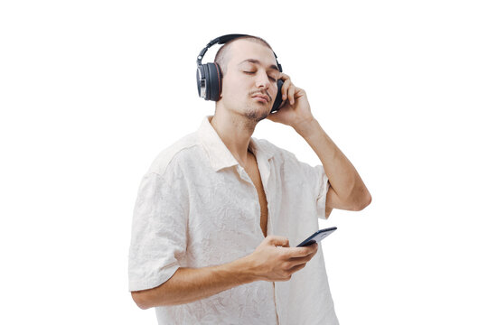 Relaxed Young Man Listening to Music with Headphones and Eyes Closed