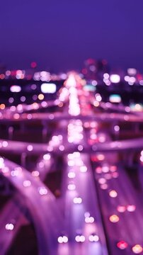 A captivating twilight scene showcasing a vibrant cityscape illuminated with dynamic bokeh lights, capturing the essence of urban life and the pulse of evening traffic.