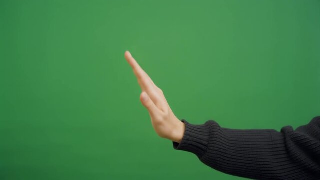 Clean human hand executing a vertical swipe up gesture against a green screen for mobile app feed scrolling, social media navigation, and digital marketing motion graphics overlays.
