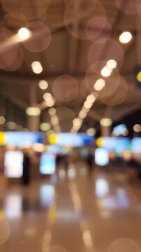 Blurred Views of a Busy Airport Terminal Showcasing the Modern Design and Dynamic Energy of Travelers in a Hectic Environment