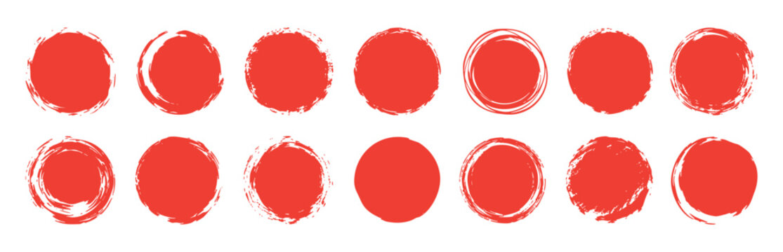 A collection of red grunge brush circles isolated on white background. Hand-drawn circular paint strokes, artistic ink stamps, and distressed round shapes.