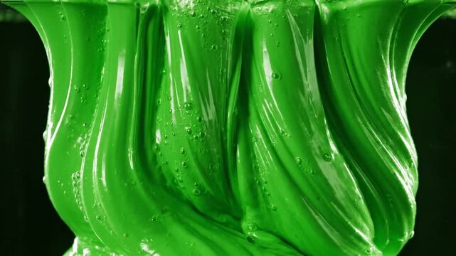 Vibrant green goo flowing viscous substance