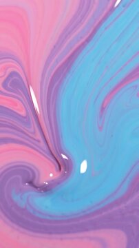 A Captivating Blend of Colors: Swirls of Pink, Purple, and Blue Create a Dreamy Abstract Visual Journey Through Colorful Patterns and Movement