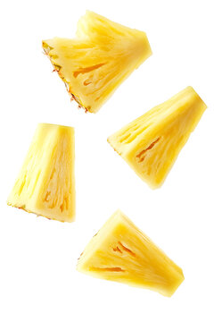 Group of juicy ripe pineapple fruit wedges flying on transparent background cutout set.
