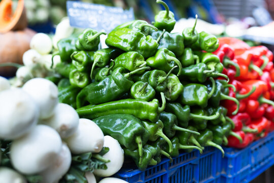 Pile of peppers displayed on market counter