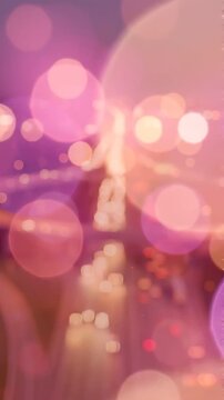 A Serene Evening Journey: A Blurry Roadscape Illuminated by City Lights Under a Soft Purple Sky, Representing the Calm in Urban Commuting