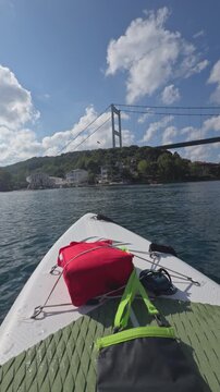 First person paddleboard view looking toward Fatih Sultan Mehmet Bridge over the Bosphorus near Anadolu Hisari Beykoz Istanbul