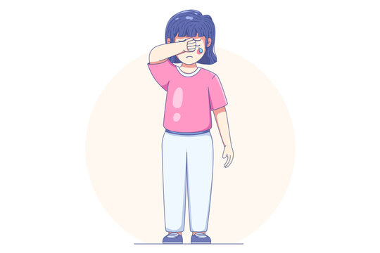 Sad young girl wiping tears from her eyes while crying, expressing emotional distress and childhood sadness