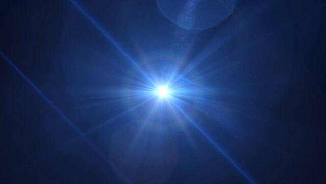 Bright blue lens flare dominates the dark background. Radiant light bursts outward in crisp