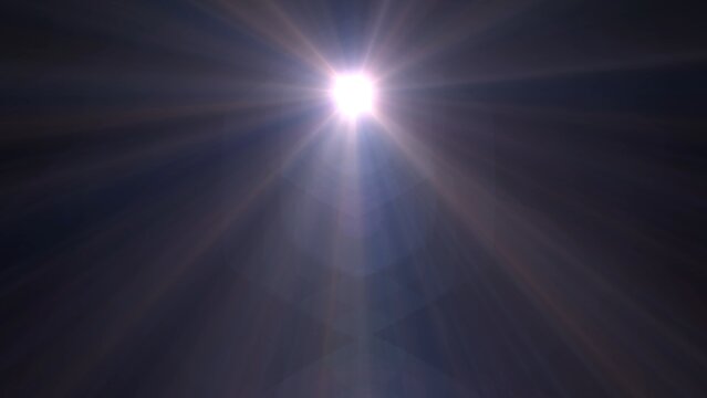 Bright sun shines through dark sky. Radiant beams stretch outward from glowing core