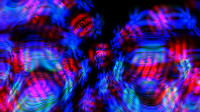 Vibrant abstract image featuring colorful light reflections and swirling patterns with glowing effects against a dark background, creating a dynamic and energetic visual.
