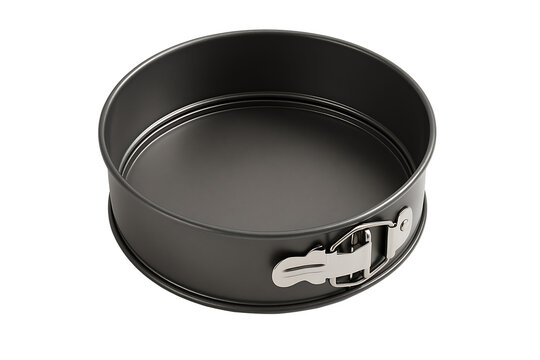 High angle view of a dark grey round non stick springform baking pan isolated on a solid white background for culinary and baking concept