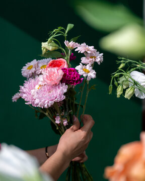 Florist Holding Colorful Flower Bouquet with Roses Chrysanthemums Carnations and Daisies