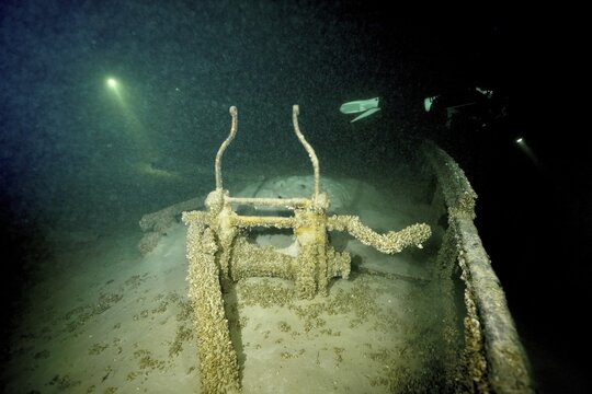Gloomy shipwreck in Lake Constance, illuminated by rays of light and overgrown with quagga triangle mussels (Dreissena rostriformis bugensis), an invasive species. Dive site wreck of the Jura, Lake Constance, Bottighofen, Switzerland, M&uuml;nsterlingen, Germany