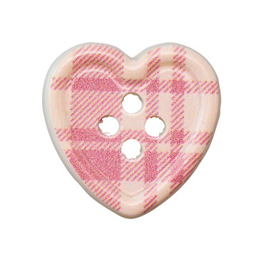 Heart shaped glittery pink and beige plaid sewing button isolated on white background