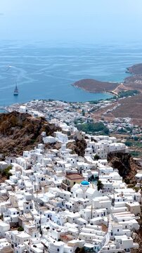 Aerial view of the main town Hora on Serifos island, Cyclades, Greece, with the bay and port of Livadi in the background