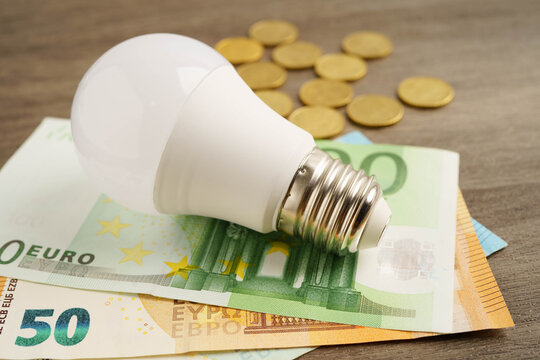 Cost of electric utilities with light bulb for payment.