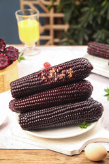 Sweet Black Sticky Corn Cobs with Fresh Jade Kernels on White Plate - Healthy Organic Vegetable Food © BuiThi