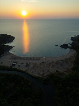 Drone Flying Forward Over Silistar Beach Bay at Golden Sunrise Sunset