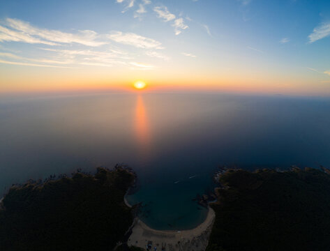 Drone Flying Forward Over Silistar Beach Bay at Golden Sunrise Sunset