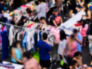 Fototapeta premium Blurred traditional clothes market.