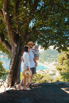 Family standing under tree at Croatia viewpoint