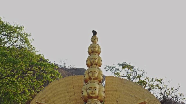 Wild Macaque Monkey On Golden Buddhist Statue In Thailand. Buddhism, Cultural Landmark And Travel Destination Concept