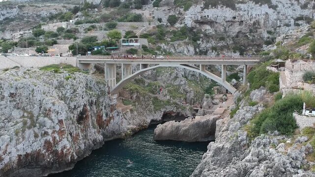 Aerial Drone View of Grotta della Poesia Prehistoric Sea Cave, Roca Vecchia, Ocean, Puglia, Italy