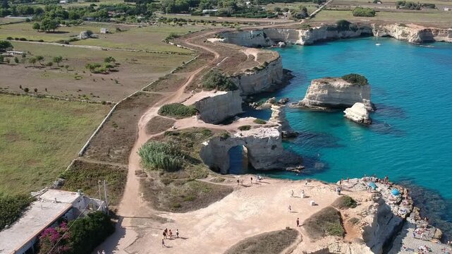 Aerial Drone View of Torre Sant'Andrea Watchtower and White Limestone Coast, Sea, Ocean, Beach, Puglia, Italy