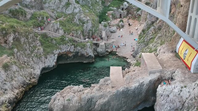 Italy, Puglia, Drone Footage of Natural Rock Arch Over the Adriatic Sea, Ocean, Beach