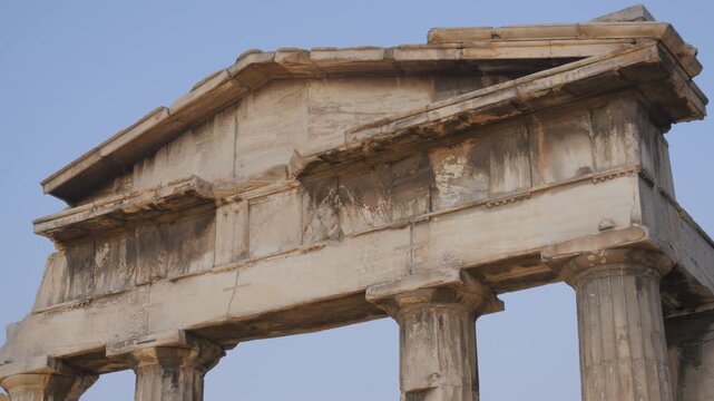 Gate of Athena Archegetis temple columns standing under a clear blue sky in Athens, Greece