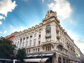 Fototapeta premium Historic ornate building on Knez Mihailova Street under dramatic sunbeams
