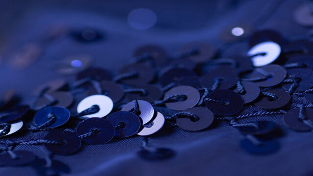 Macro shot of midnight blue sequins on a navy blue dance costume
