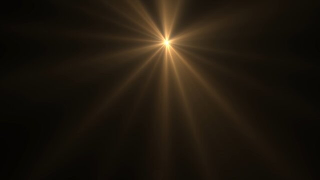 Golden light radiates from center against deep black background. Bright rays stretch outward