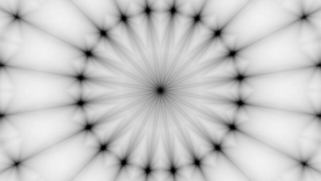 A striking black and white radial pattern featuring starburst shapes and symmetrical design elements