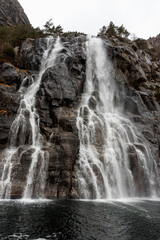 Hengjanefossen Waterfall in Lysefjord, Norway – Scenic Cascade and Granite Cliffs © Olga