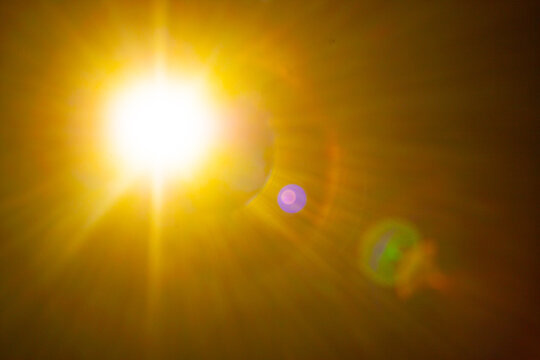Sun flare on the black background