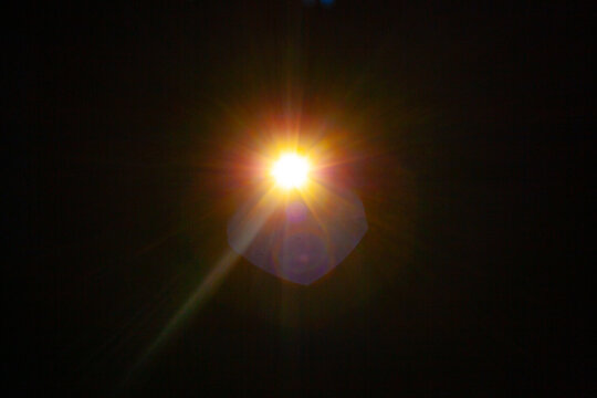 Sun flare on the black background