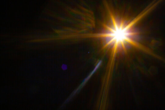 Sun flare on the black background