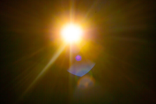 Sun flare on the black background