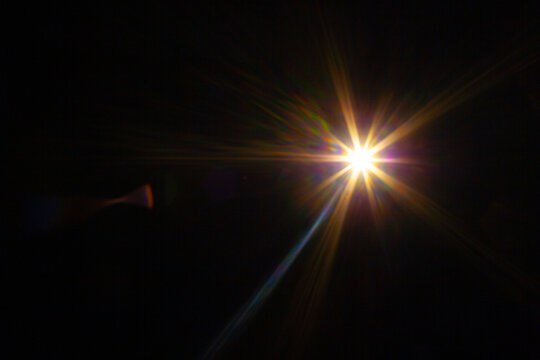 Sun flare on the black background